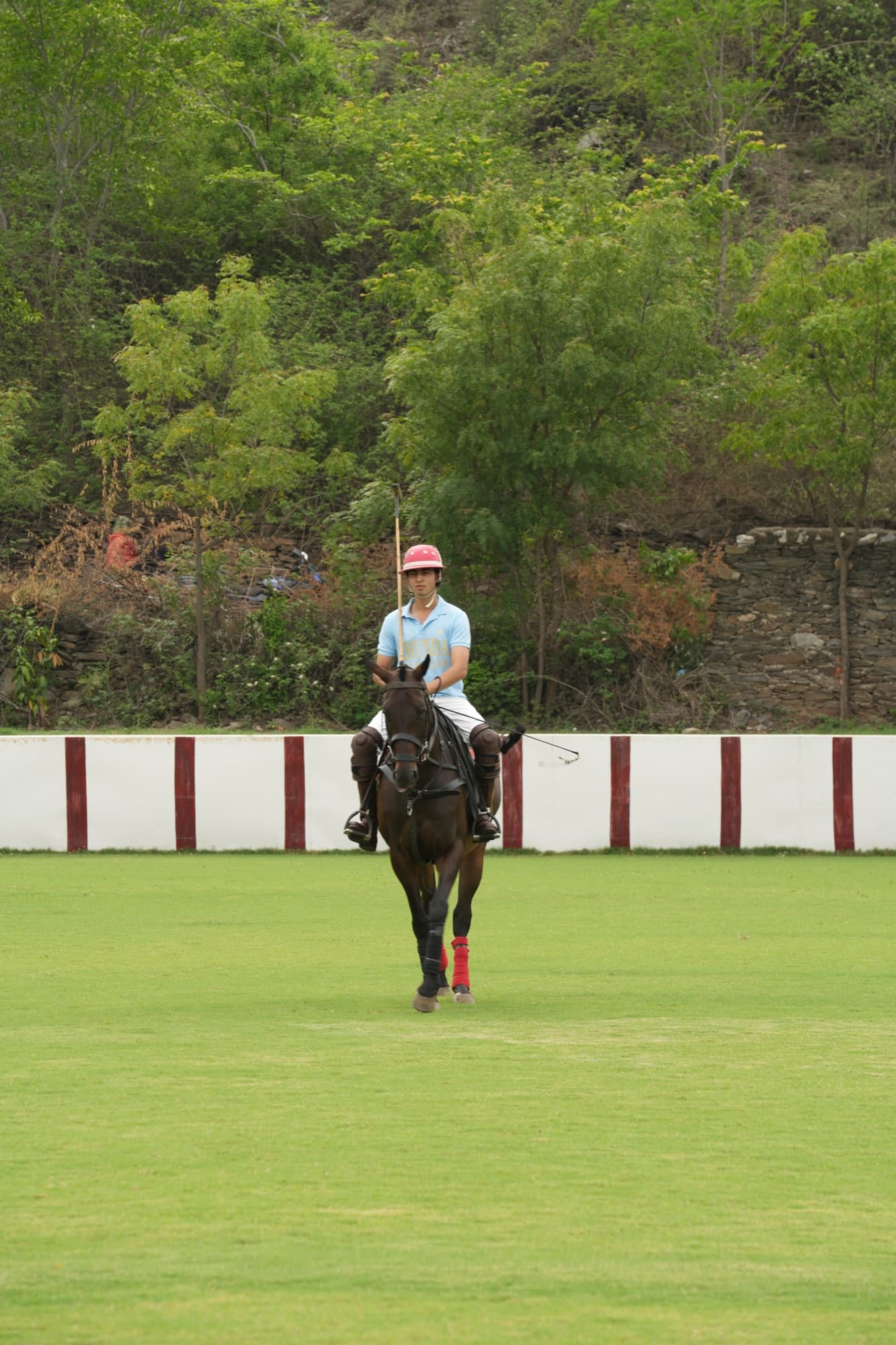 Pradhyuman on horseback in polo colours